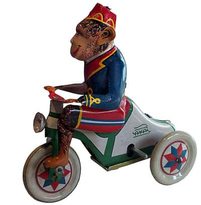 Retro plechová hračka opica na motorke
